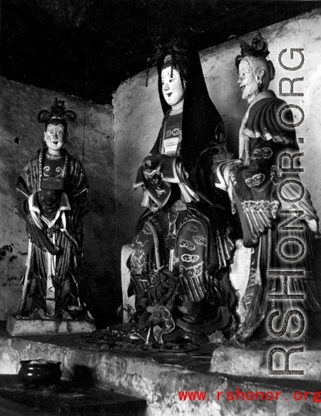 Statues inside a Buddhist temple in Yunnan, China. During WWII.