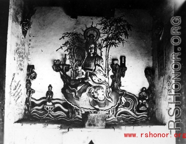Figure inside a Buddhist temple in China. During WWII.