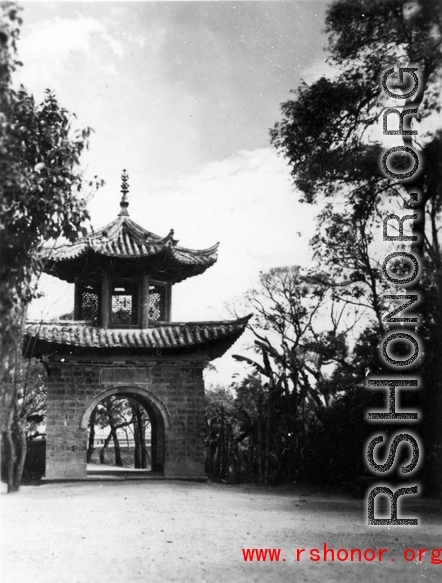 Architecture in Yunnan province, China: A decorative arch as a passageway in a village in rural Yunnan, during WWII.