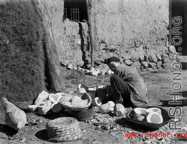 Local people in China: A village woman cleaning melons.