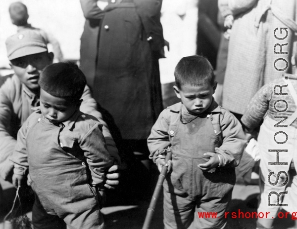 Nationalist soldier and kids in Yunnan during WWII.