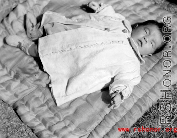 A sleeping baby in China during WWII, in Yunnan province.