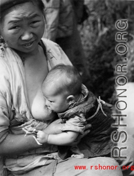 A mother and nursing baby in Yunnan province, China, during WWII.