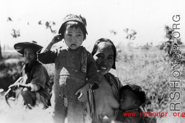 A mother and children in Yunnan province, China, during WWII.