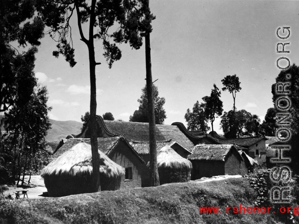 A local village in China during WWII, the houses with thatched roofs.