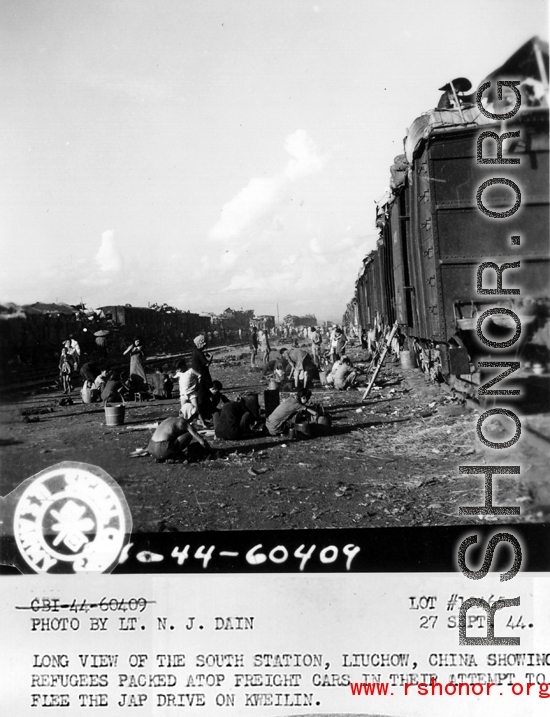 September 27, 1944  During WWII, long view of the south station, Liuchow, China, showing refugees packed atop freight cars in their attempt to flee the Japanese drive on Kweilin (Guilin).   Photo by Lt. N. J. Dain