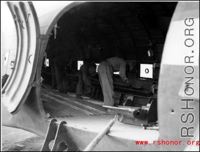 10AF 10Dec44 Preparing to load mules on [C-47] cargo plane, Burma, during WWII.