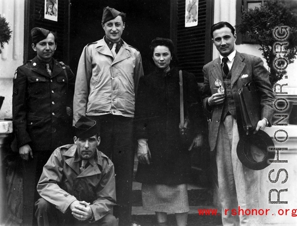 An elite Chinese woman poses with American servicemen and local people in Yunnan province, China, during WWII. 