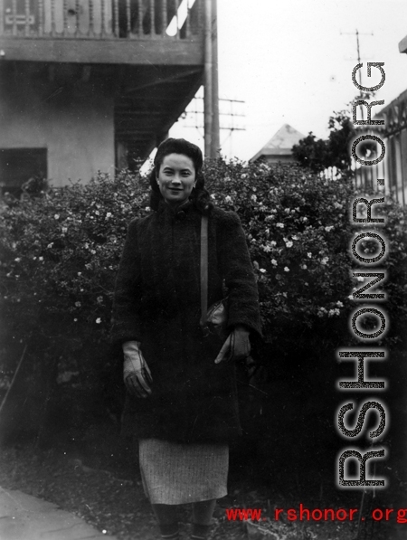 Local people in Yunnan province, China: An elite woman poses for the camera during WWII.