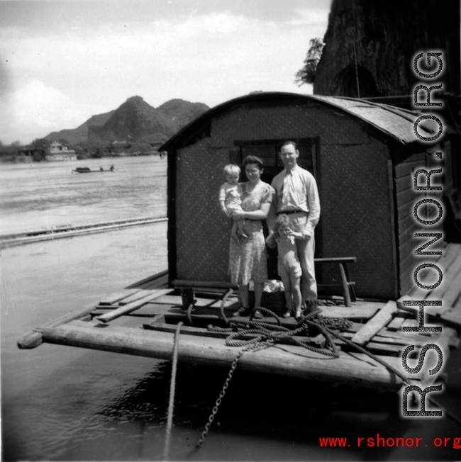 A western family on a barge in a river in Guangxi province, probably near Liuzhou city or Guilin city.  Selig Seidler was a member of the 16th Combat Camera Unit in the CBI during WWII.