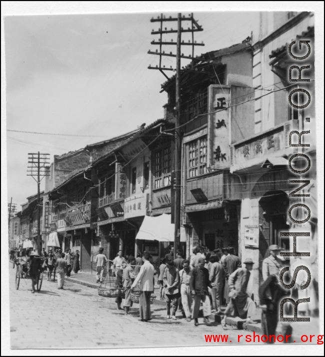 Street scene in a China city, mostly likely Kunming. During WWII.