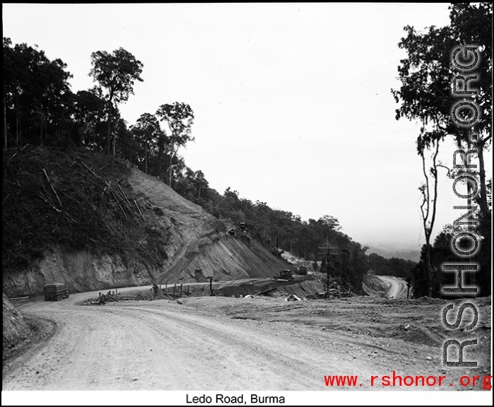 US military transport trucks wind along the Ledo Road, Burma, during WWII.