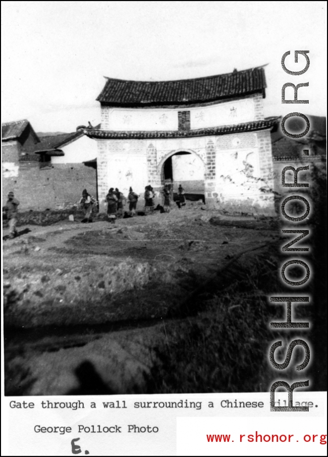 A village gate in a style once typical of Yunnan and Guizhou province, with a saying "Mountains Lofty and Clouds Deep" (“岭峻云深”) written above the gate. During WWII.  Photo from George Pollock.