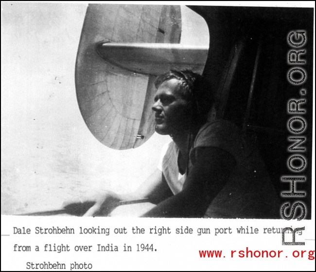 Dale Stronbehn looking out the right side gun port while returning from a flight over India in 1944.