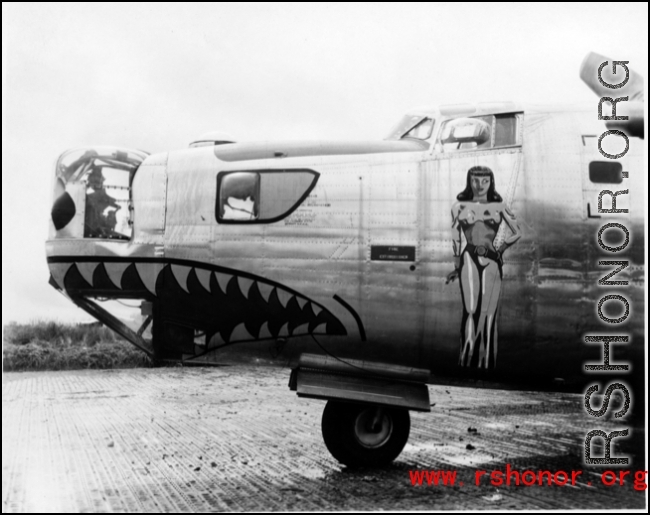A B-24 bomber with nose art in the CBI during WWII.
