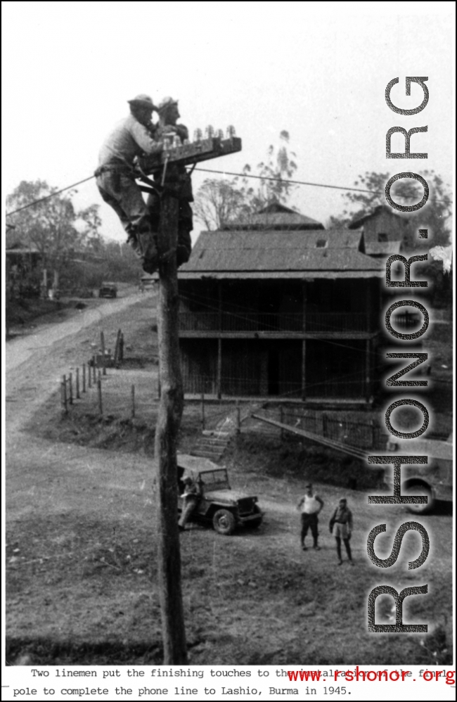 Two linemen putting finish on line from Ledo-Burma Road junction to Allied communications HQ at Lashio, Burma, in 1945, with two technicians up on pole working.
