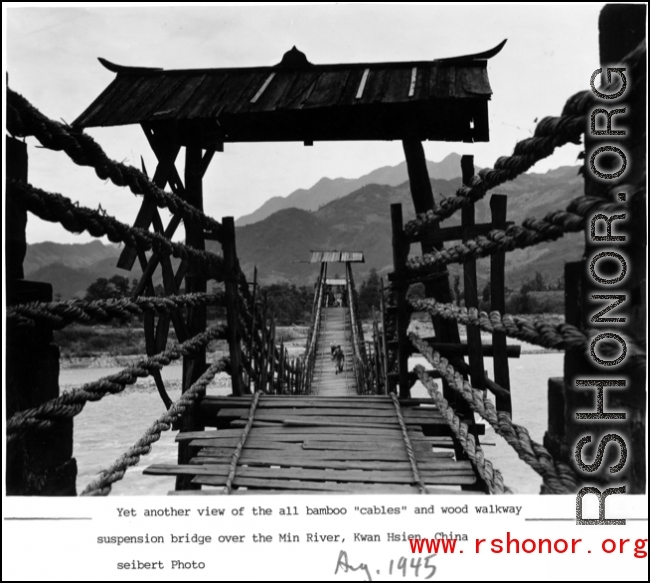 All bamboo "cables" and wood walkway suspension bridge over Min River, Guan county (Guanxian/Kwan Hsien), China, August 1945.  Photo from Selbert.