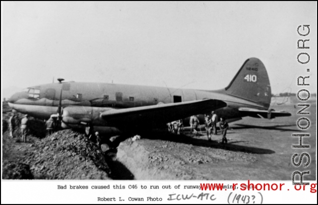 A C-46 transport plane, tail #112410, in a ditch because of brake failure at Kunming, China, during WWII. ICW-ATC, probably 1943.  Photo from Robert L. Cowan.