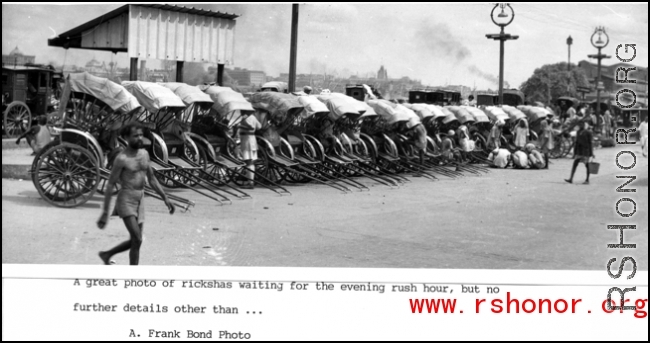 Rickshaws lined up awaiting evening trade in India or Burma during WWII.  Photo from A. Frank Bond.