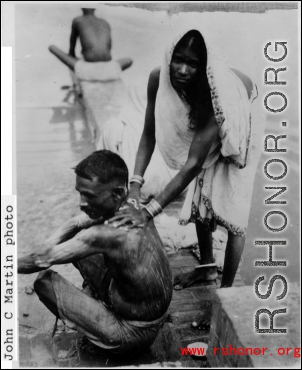 A domestic riverside bath in India during WWII.  Photo from John C. Martin.