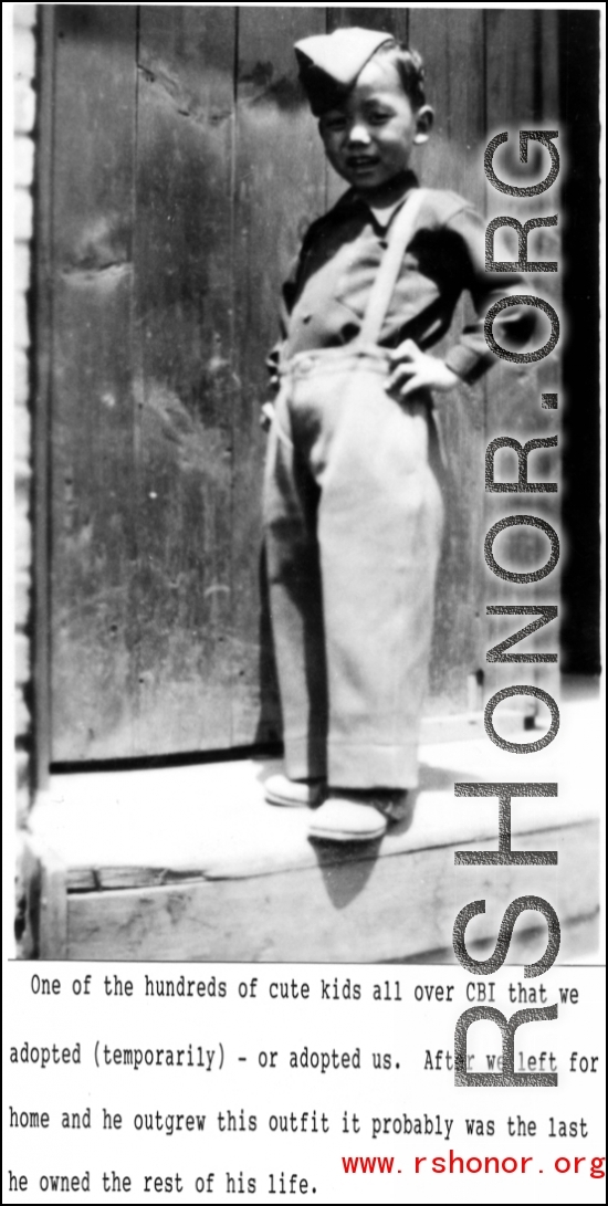 The Chinese child nicknamed "Little Tiger Joe" posing in doorway, during WWII.