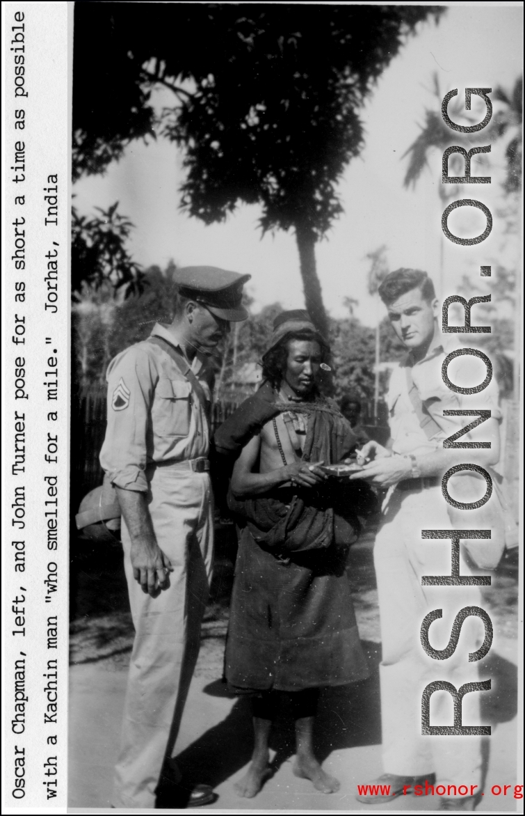 Oscar Chapman, and John Turner pose with a Kachin man at Jorhat, India, during WWII.