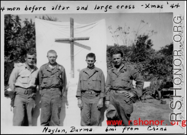 For men of Mars Task Force (124th Cavalry) stand before alter and large cross in Christmas, 1944, at Naylon, Burma, six miles from China.