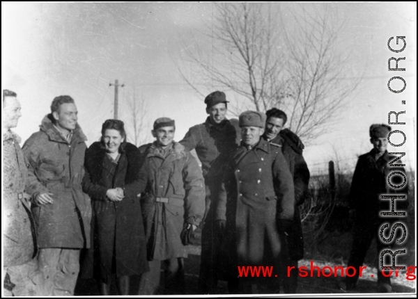 American GIs and a woman in the northern part of China, in cold weather. During WWII.