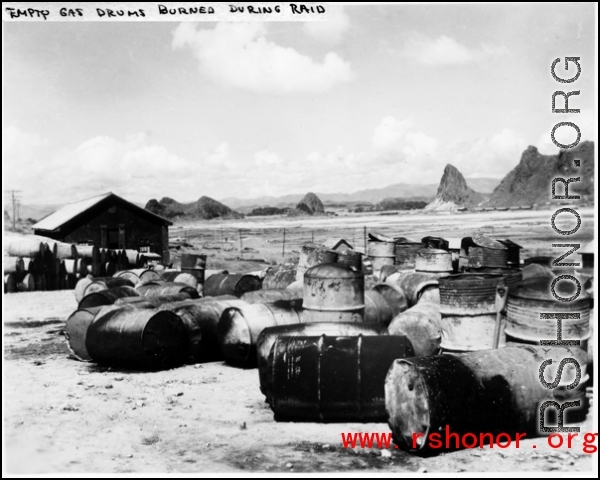 "Empty gas drums burned during raid." Karst hills in the background hit that this is likely a US base in Guangxi province, China, either at Liuzhou or Guilin.