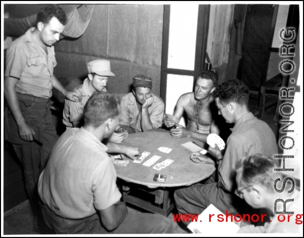 American servicemen while away the time playing cards in the CBI during WWII.