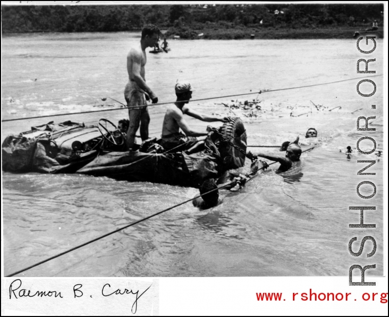 GIs float a jeep--wrapped in canvas to give it buoyancy--across the Moguang River in Burma, June 20, 1944.  Photo Raimon B. Cary. An identical image was submitted by Robert L. Cowan.