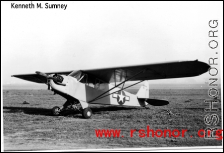 A tidy looking L-5 airplane parked in a field in the CBI during WWII.  Photo from Kenneth M. Sumney.