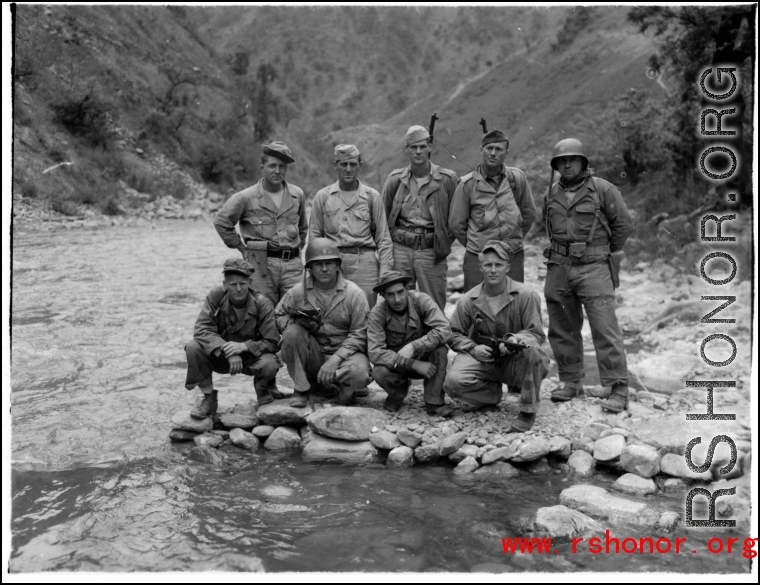 A group of American GIs during WWII near a river, likely in SW China, or Burma.