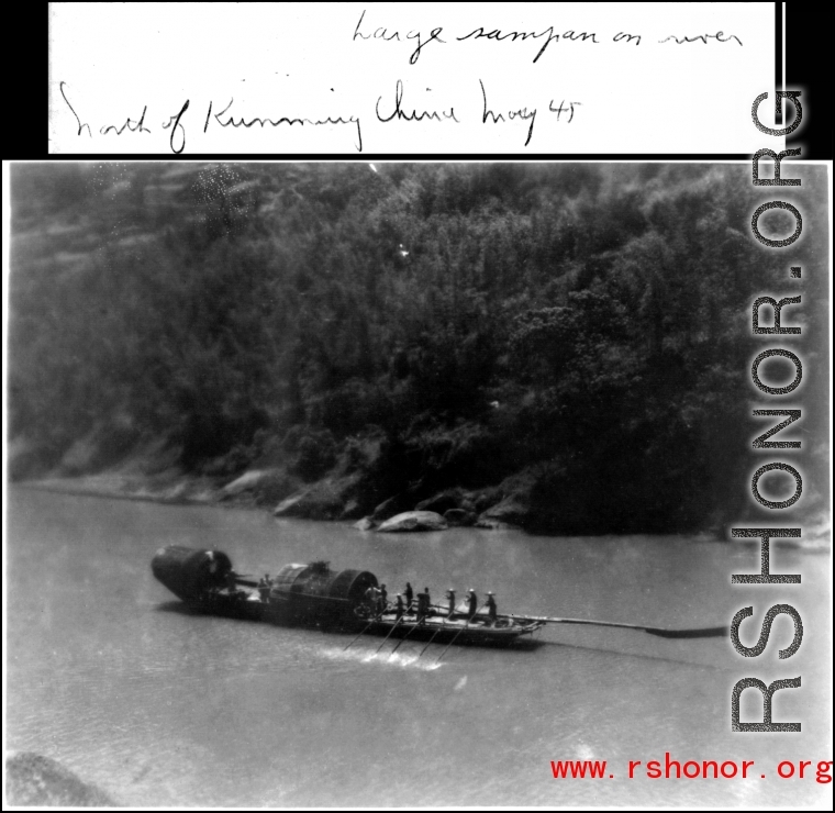 Large sampan with a number of oarsmen on river north of Kunming, China, May 1945.