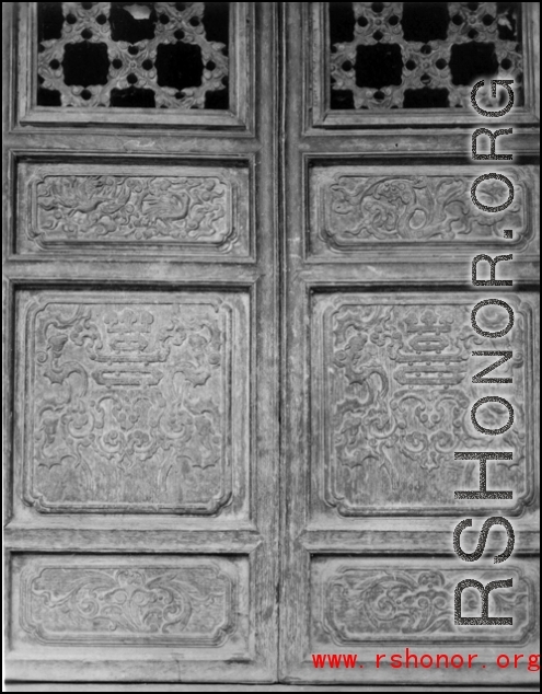 A carved wooden door panel in China. During WWII.  From the collection of Frank Bates.