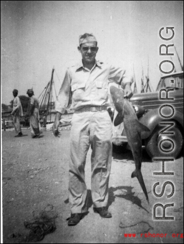 GI holding shark in Karachi, India 1942.  From the collection of Frank Bates.