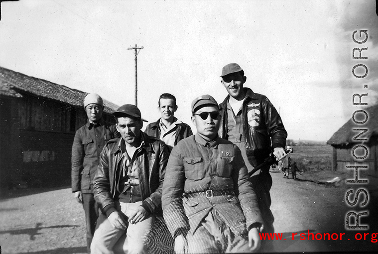 Three US servicemen with a local civilian and with a Chinese soldier, most likely in Yangkai, Yunnan, China.  Walter is sitting on the left in the front.