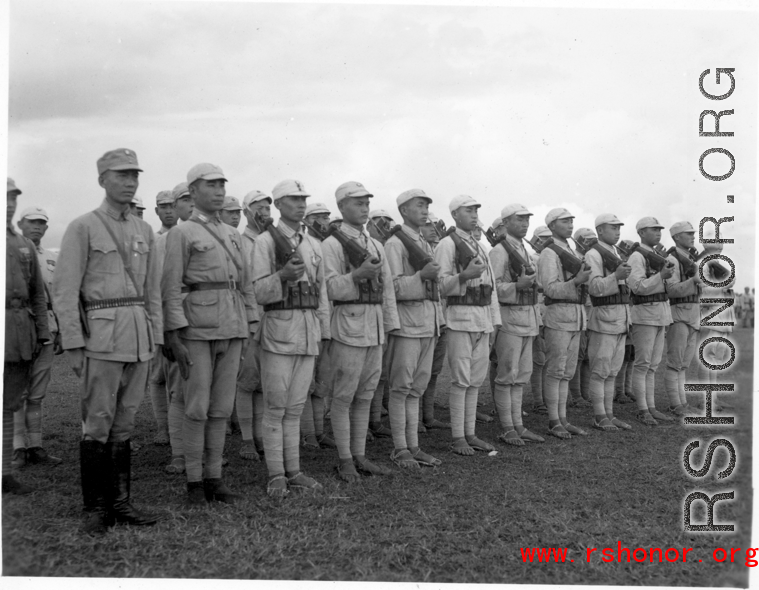 Chinese soldiers standing in ranks during rally.
