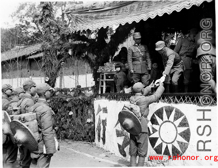 Chinese soldiers during in a ceremony as part of a shooting contest ("射击比赛)" in southern China, probably Yunnan province, or possibly in Burma.
