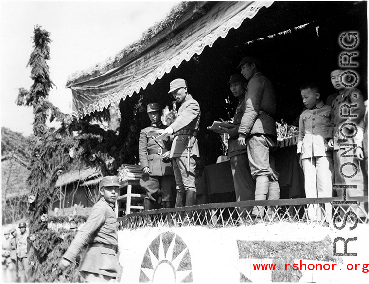 Chinese soldiers during in a ceremony as part of a shooting contest (射击比赛) in southern China, probably Yunnan province, or possibly in Burma.