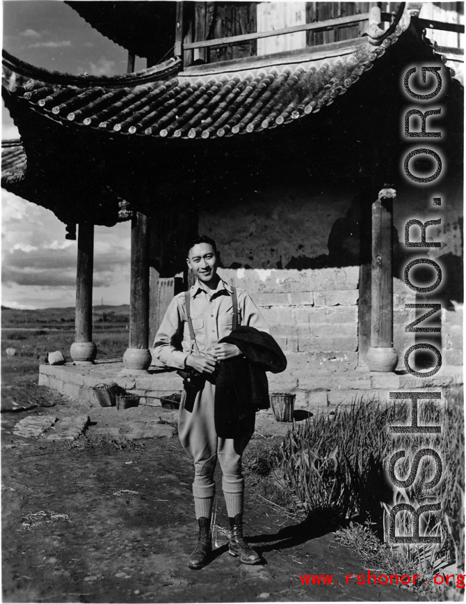 A VIP Chinese man poses before a pavilion in Songming county during WWII.