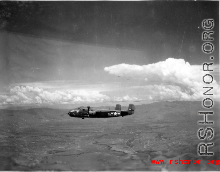 B-25 Mitchell bombers in flight in the CBI, in the area of southern China, Indochina, or Burma. During WWII.