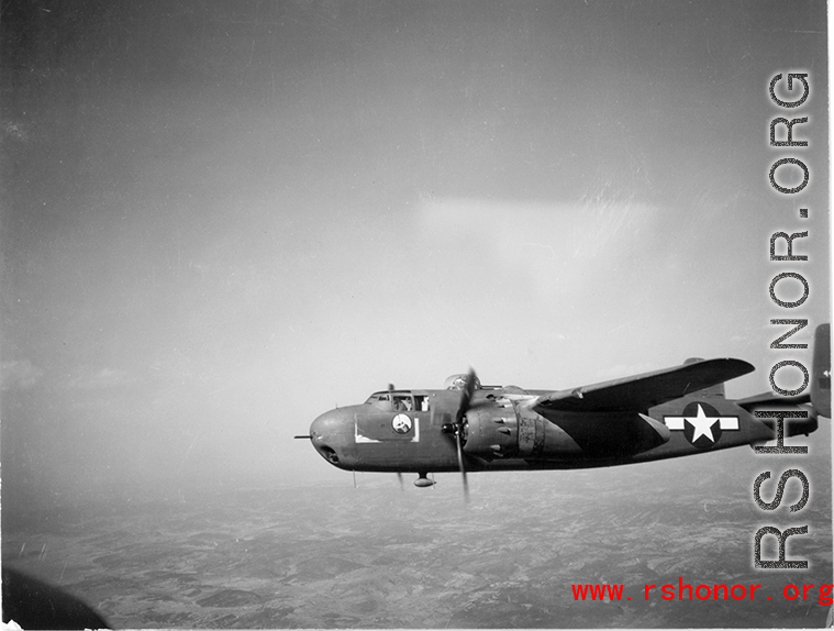 B-25 Mitchell bomber in flight in the CBI, in the area of southern China, Indochina, or Burma. During WWII.