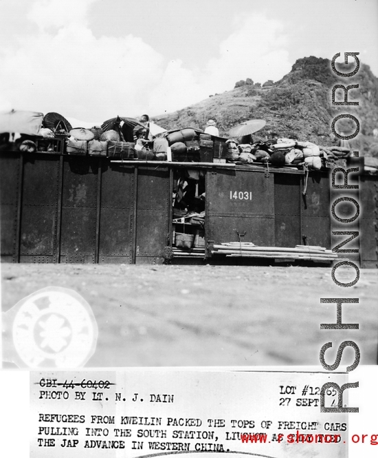 September 27, 1944  During WWII, refugees from Kweilin (Guilin) packed the tops of freight cars pulling into the south station, Liuchow, as they fled the Japanese advance in western China.