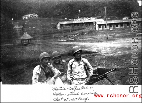 "Martin, Deffenthal, and Kaplan stand air raid alert at rest camp."  This is an unknown camp location, and should not be Camp Schiel rest station in Yunnan, China.