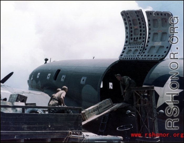 A US C-46 transport plane and cargo in the CBI during WWII.