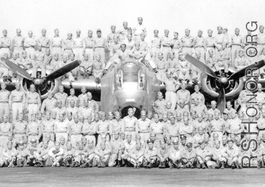 9th Bombardment Squadron, 7th Bombardment Group, 10th Air Force, pose with their B-24 bomber during WWII.