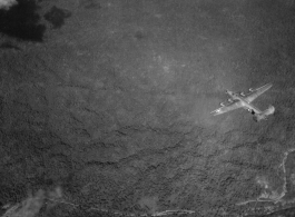 IOCU 5MP 12 AZON BOMB SECRET. A B-24 bomber flying a mission.  According to this photograph's header, it may be carrying an AZON.