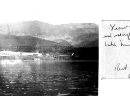 Camp Schiel rest camp in China during WWII, viewed from across the lake, taken from a small rubber raft raft or small recreational boat. March 1945.