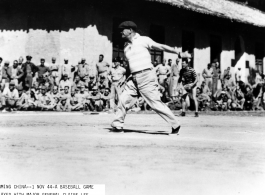 Major General Claire Chennault pitches for his team during a baseball game on November 1, 1944, in Kunming China.